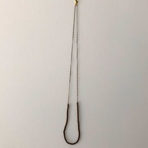 Long necklace in brass